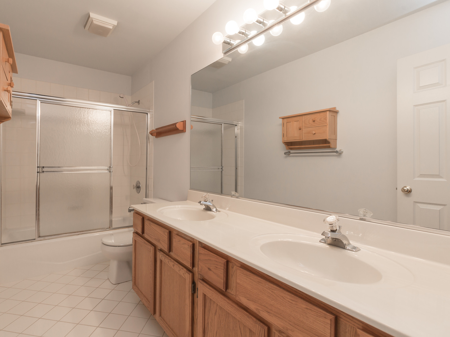 1415 Stonegate Road Algonquin, IL 60102 - Photo 30 of 49 a bathroom with a sink a toilet and shower