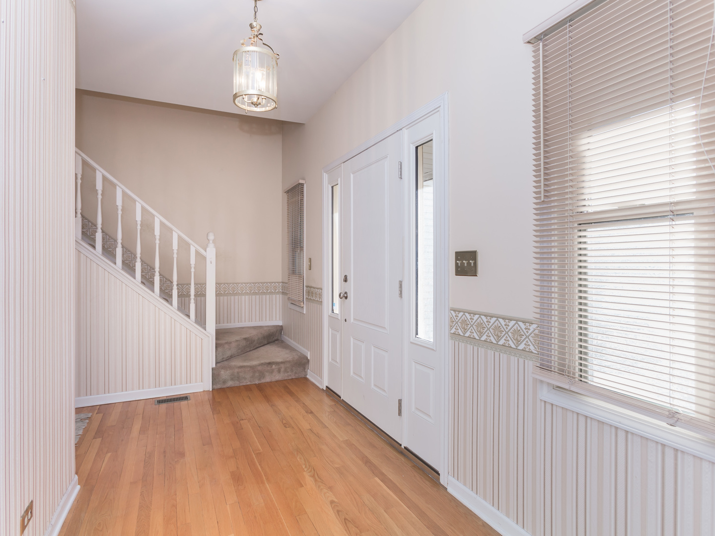 1415 Stonegate Road Algonquin, IL 60102 - Photo 3 of 49 a view of entryway with wooden floor
