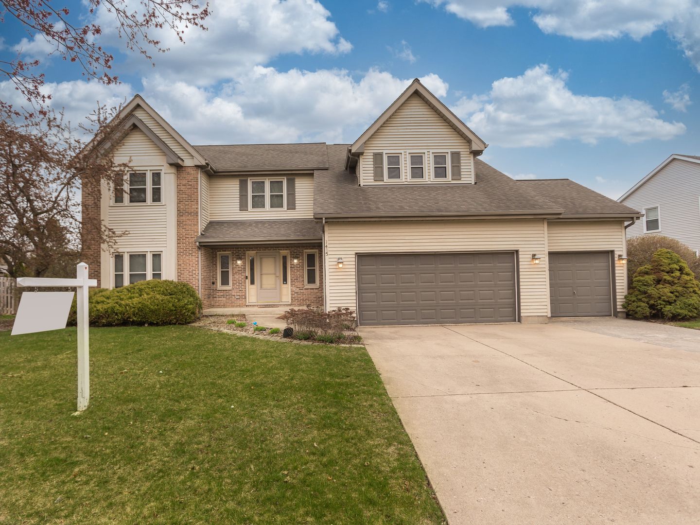 1415 Stonegate Road Algonquin, IL 60102 - Photo 49 of 49 a front view of a house with a yard and garage