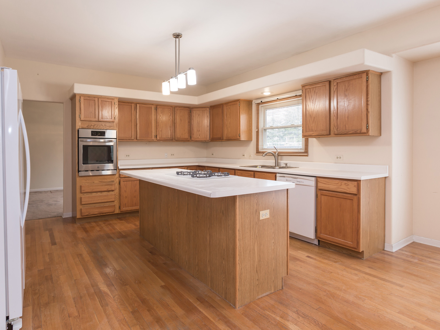 1415 Stonegate Road Algonquin, IL 60102 - Photo 9 of 49 a kitchen with kitchen island granite countertop a sink cabinets and stainless steel appliances