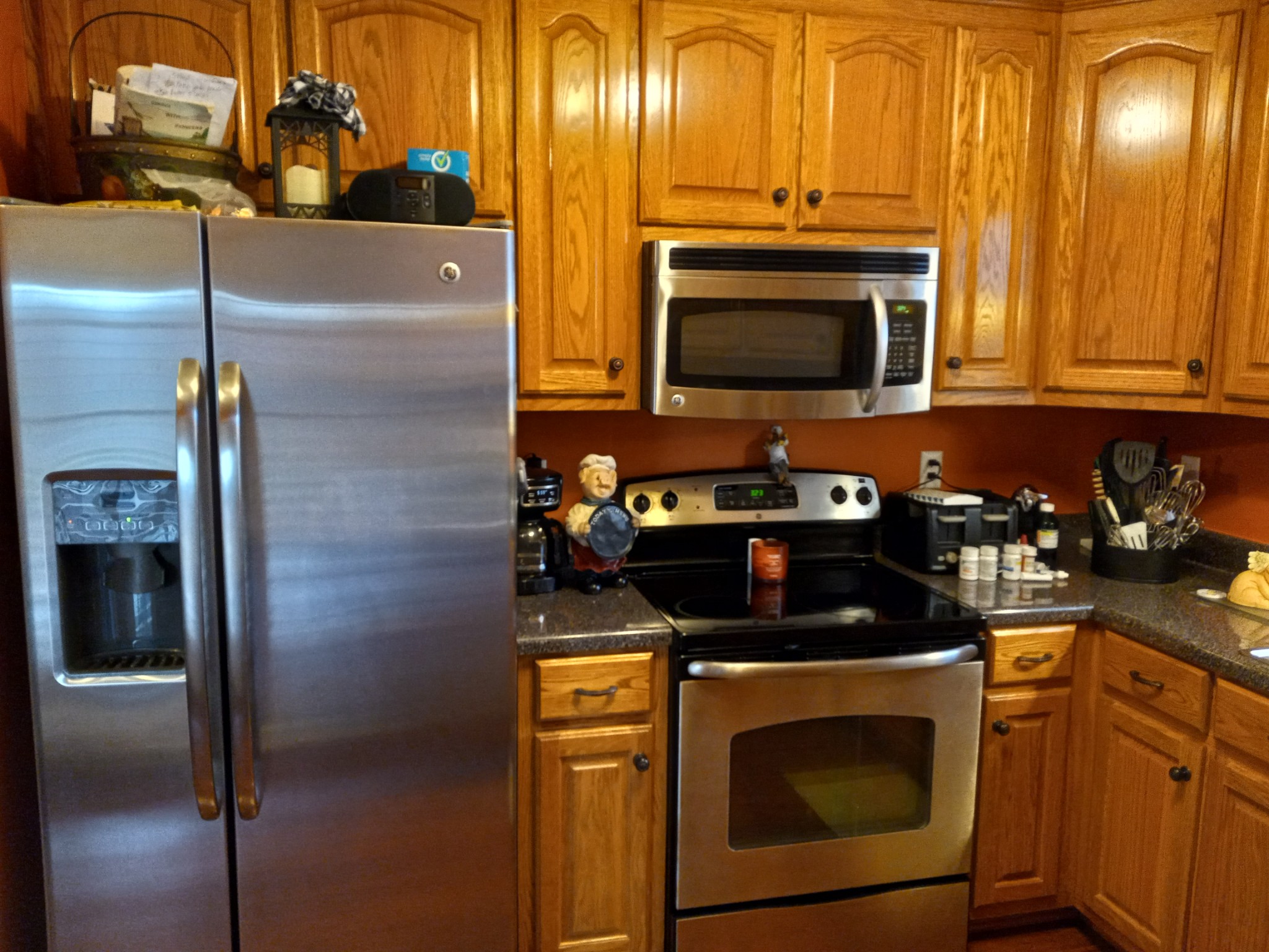 891 Nance Road Pulaski, TN 38478 - Photo 19 of 26 a kitchen with stainless steel appliances wooden cabinets and a stove top oven