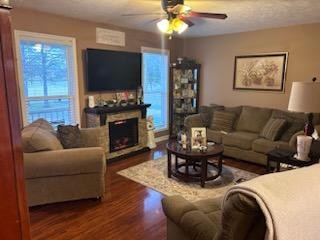 891 Nance Road Pulaski, TN 38478 - Photo 3 of 26 a living room with furniture a flat screen tv and a fireplace