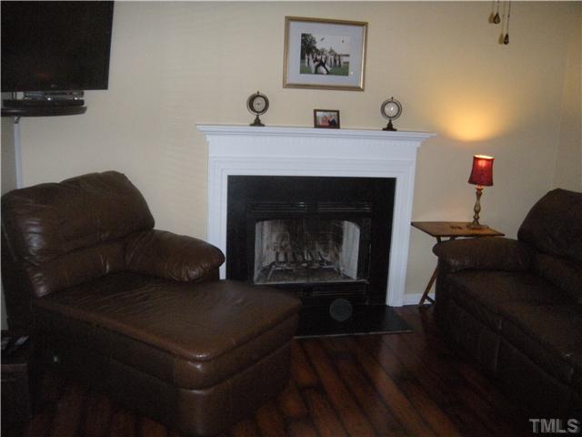 2913 New Hall Court Raleigh, NC 27615 - Photo 12 of 25 Family room with fireplace