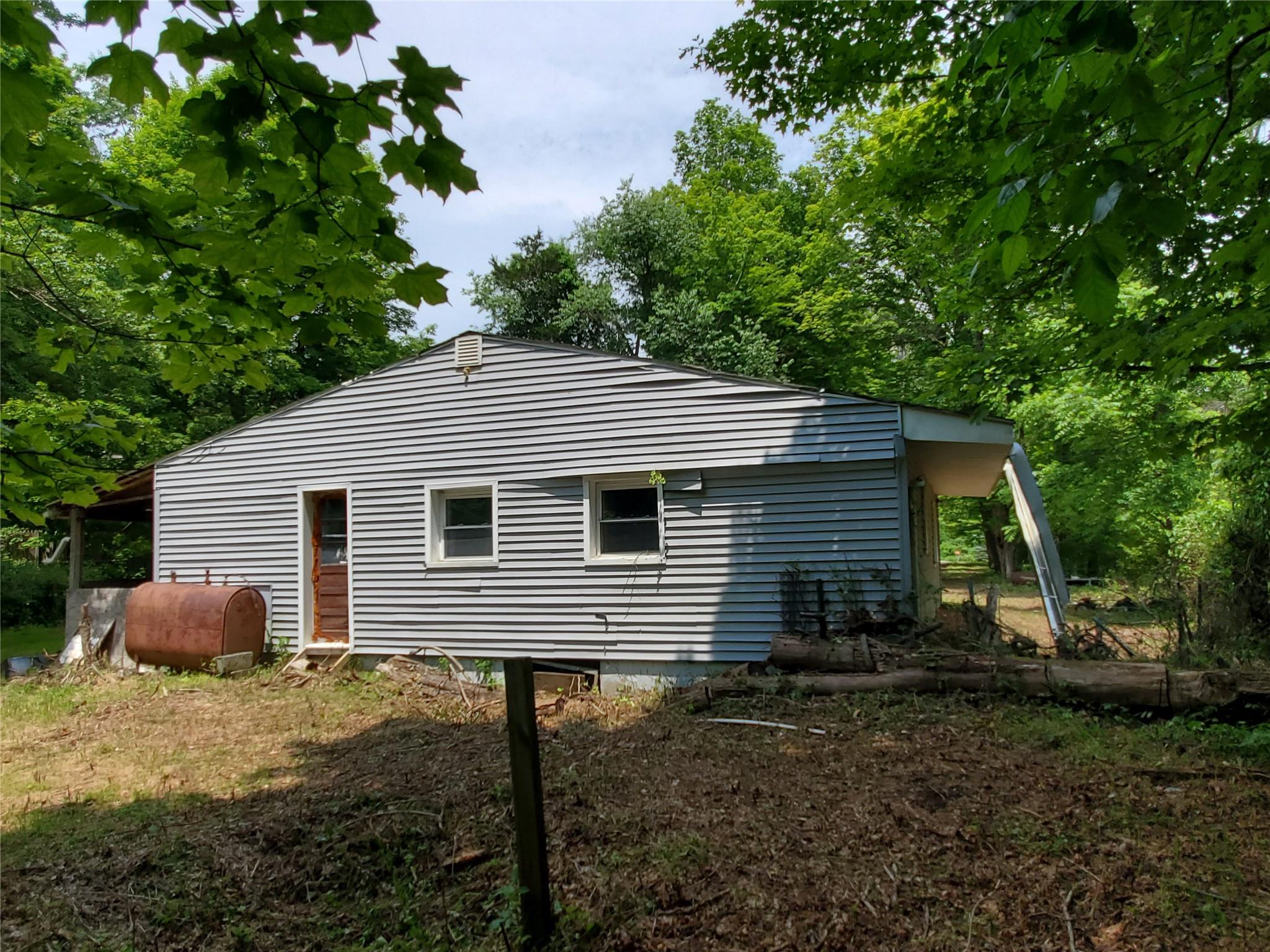 87 West Pine Road Staatsburg, NY 12580 - Photo 3 of 8 a backyard of a house with plants and tree