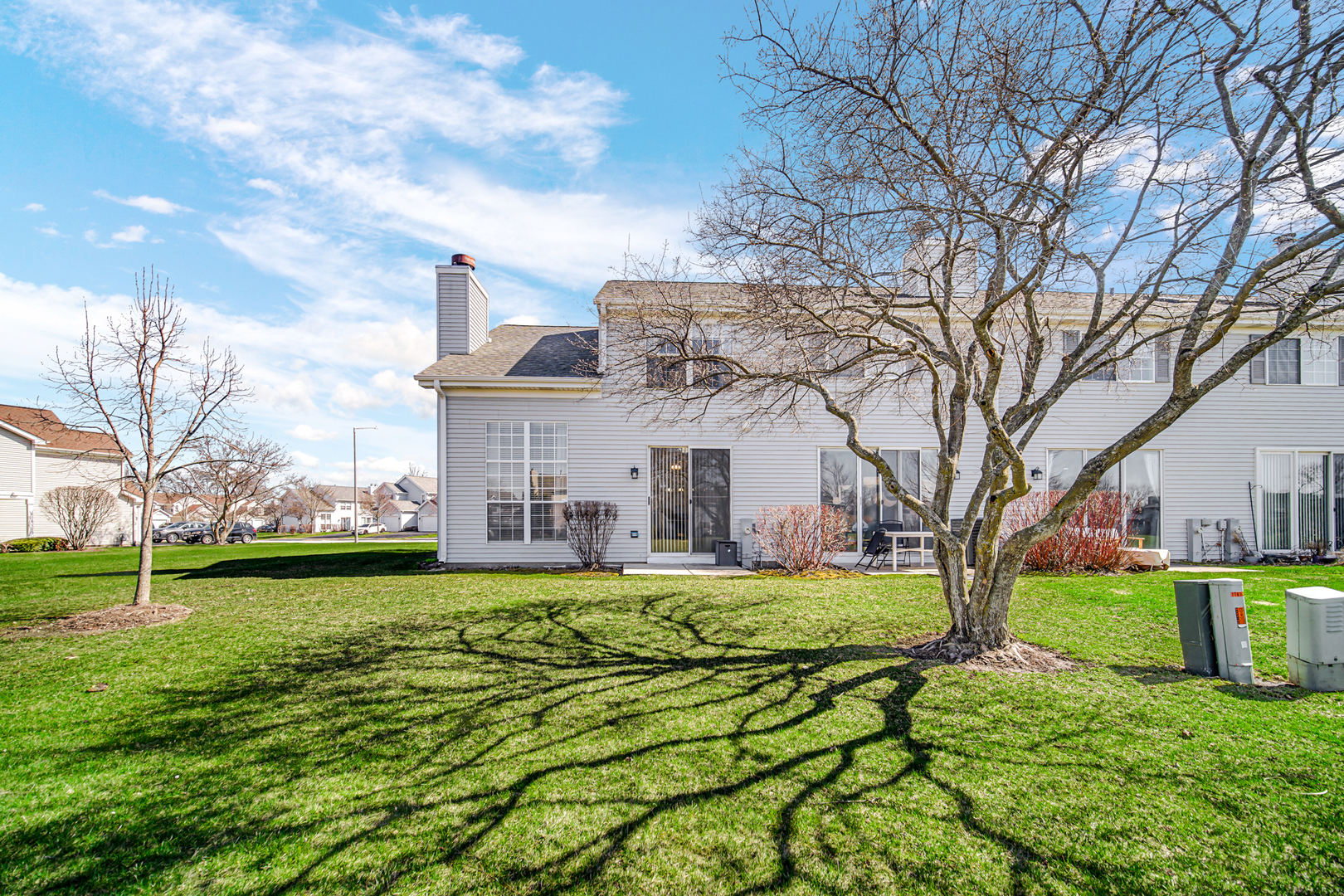 17848 Braewick Road, Unit 17848 Gurnee, IL 60031 - Photo 20 of 22 a view of a house with a big yard and a large tree