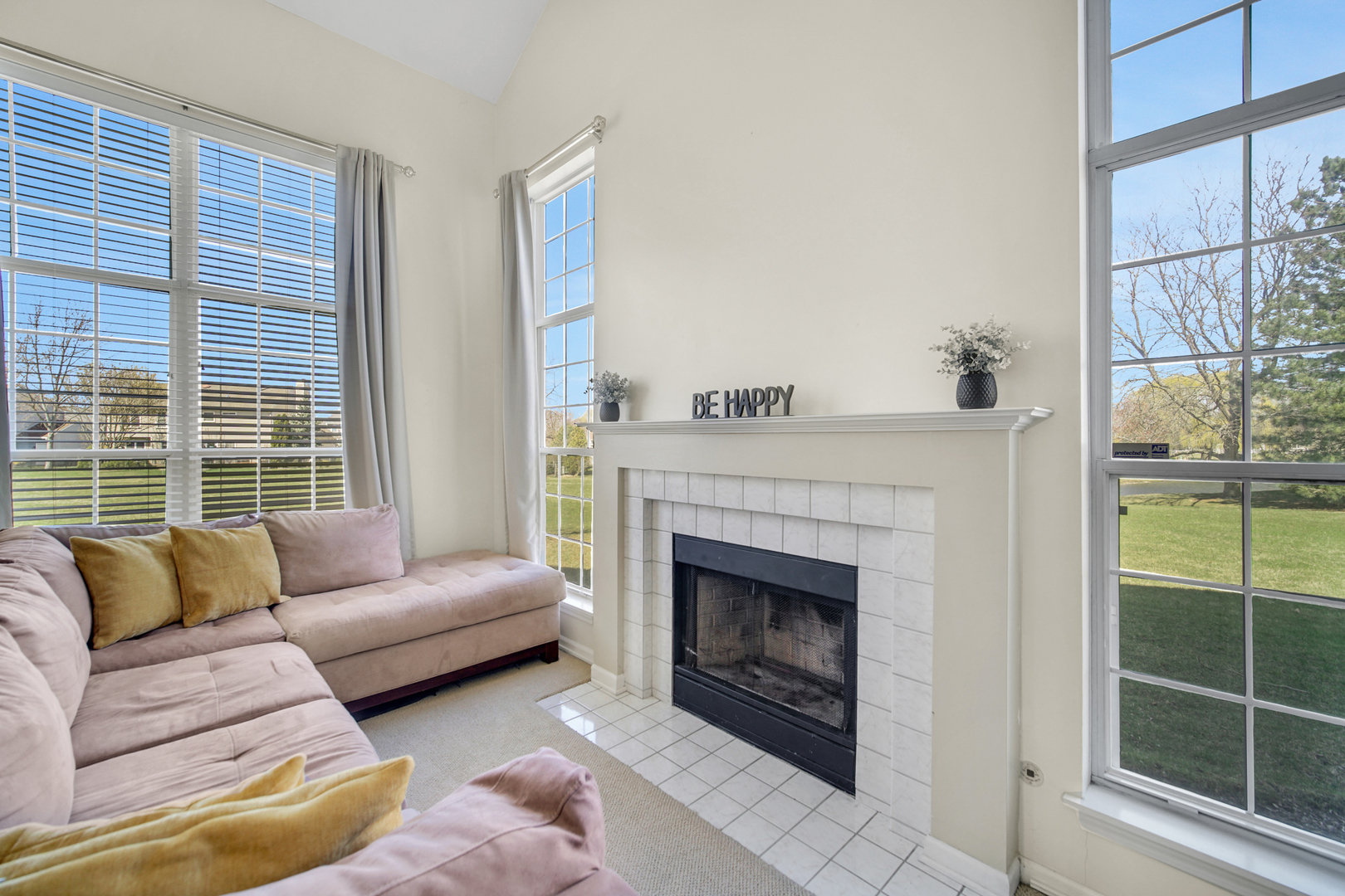 17848 Braewick Road, Unit 17848 Gurnee, IL 60031 - Photo 6 of 22 a living room with furniture and a fireplace
