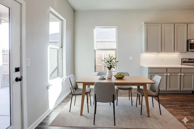 a view of a dining room with furniture and wooden floor