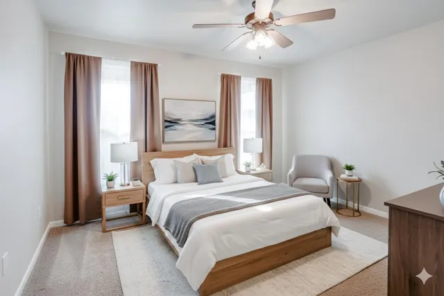 a bedroom with a large bed and a chandelier