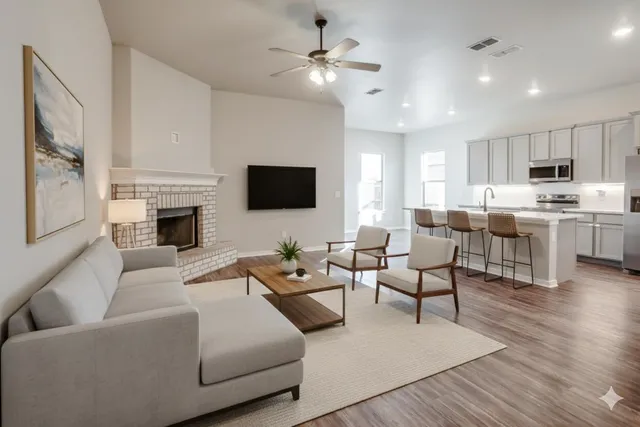 a living room with furniture fireplace and a flat screen tv