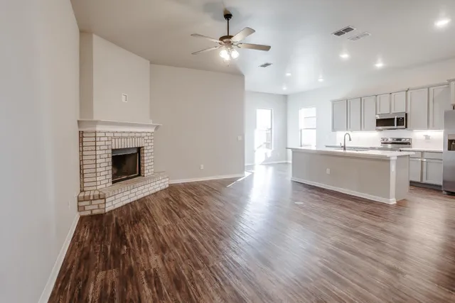 a view of kitchen and kitchen with wooden floor