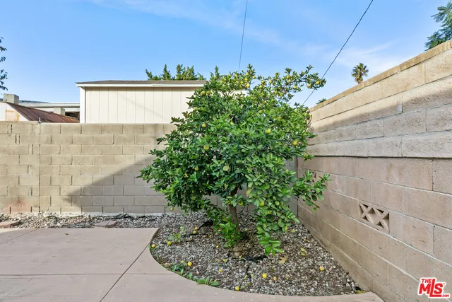 a view of a kitchen with a sink and a stove top oven