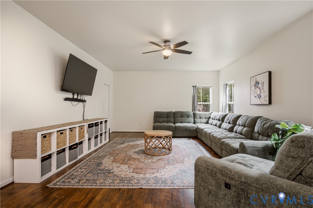 9013 Bailey Hill Road Midlothian, VA 23112 - Photo 29 of 56 Spacious living area featuring wood-finish floorin