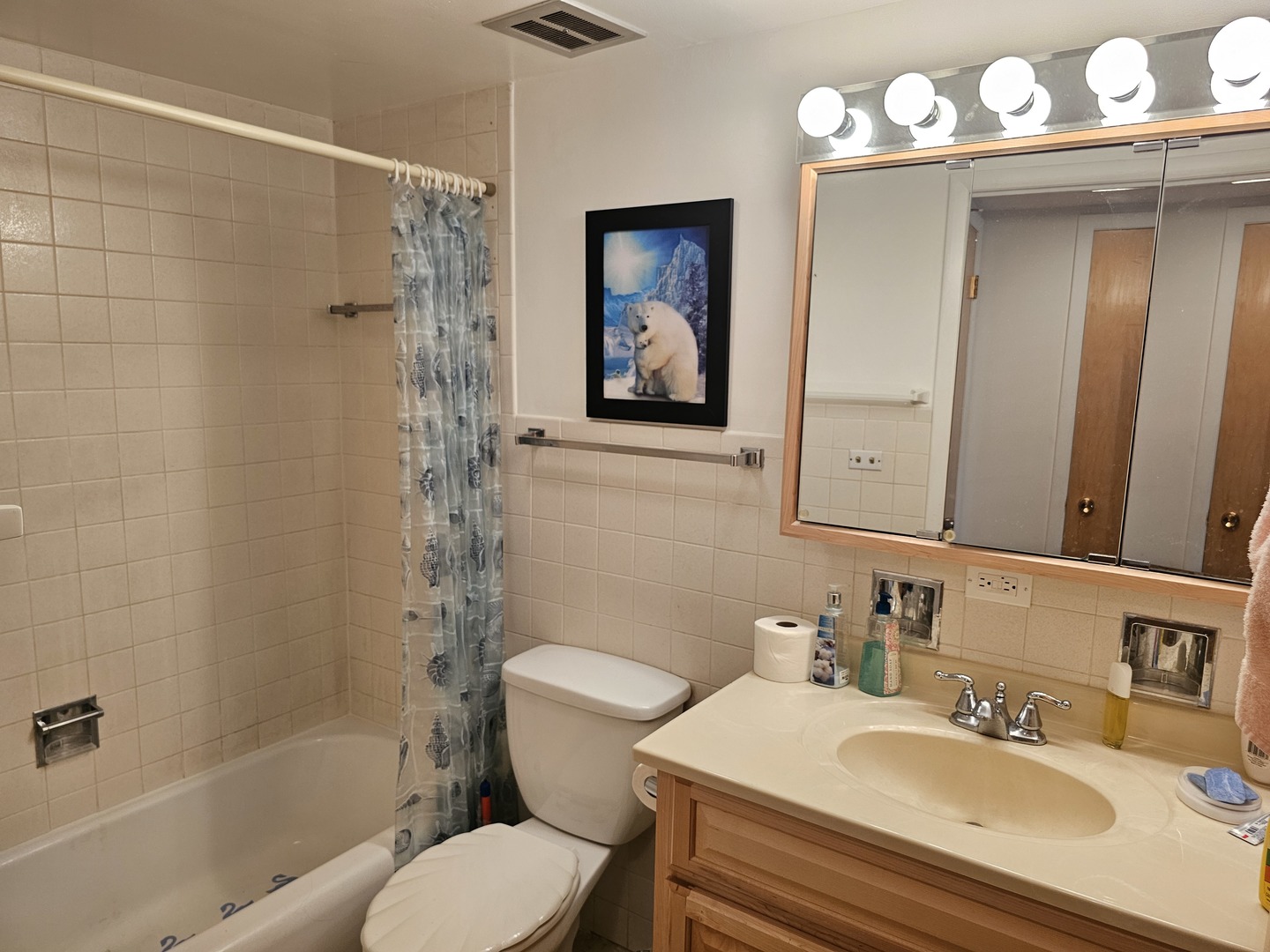 127 North Wolf Road, Unit 57B Wheeling, IL 60090 - Photo 13 of 18 a bathroom with a sink toilet and shower