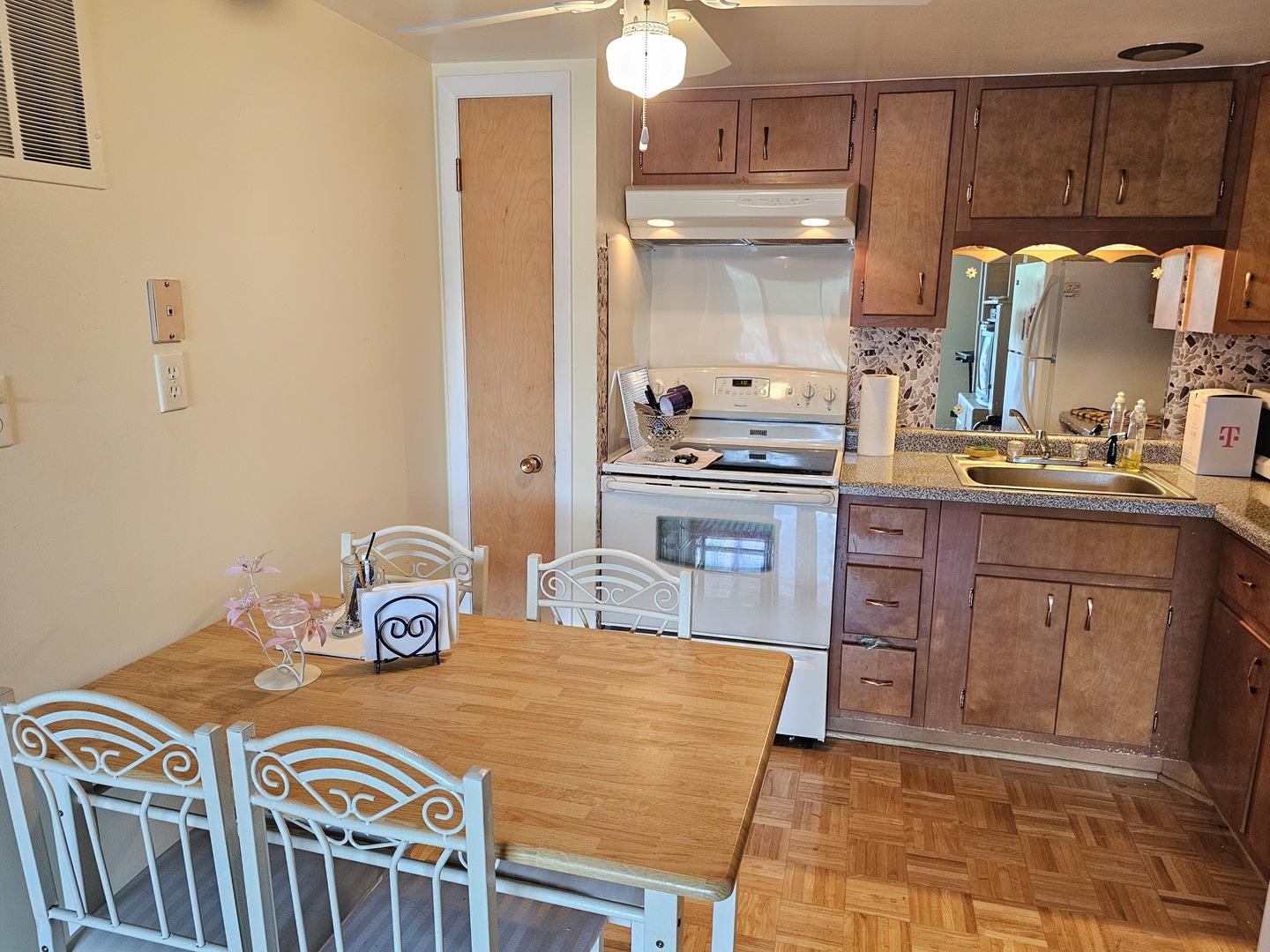 127 North Wolf Road, Unit 57B Wheeling, IL 60090 - Photo 5 of 18 a kitchen with stainless steel appliances granite countertop a sink a stove a refrigerator and cabinets