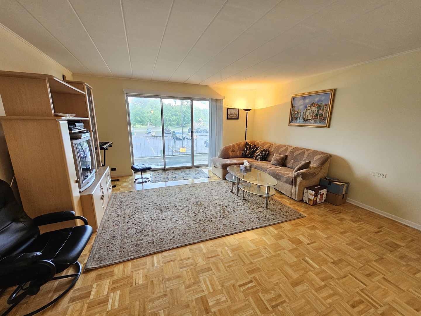 127 North Wolf Road, Unit 57B Wheeling, IL 60090 - Photo 8 of 18 a living room with furniture and a window