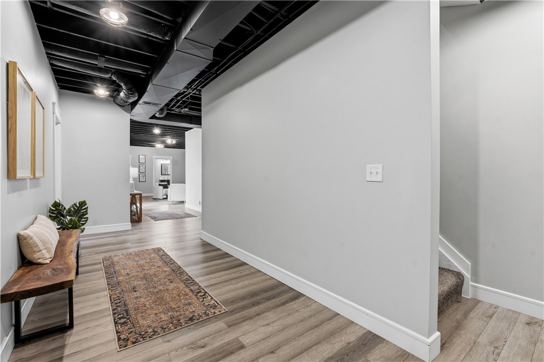 1158 Pyle Road Clarksville, OH 45113 - Photo 41 of 76 This spacious hallway offers generous proportions and elegant flooring, creating a seamless transition between living areas.