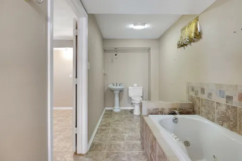 a bathroom with a sink a vanity and a mirror