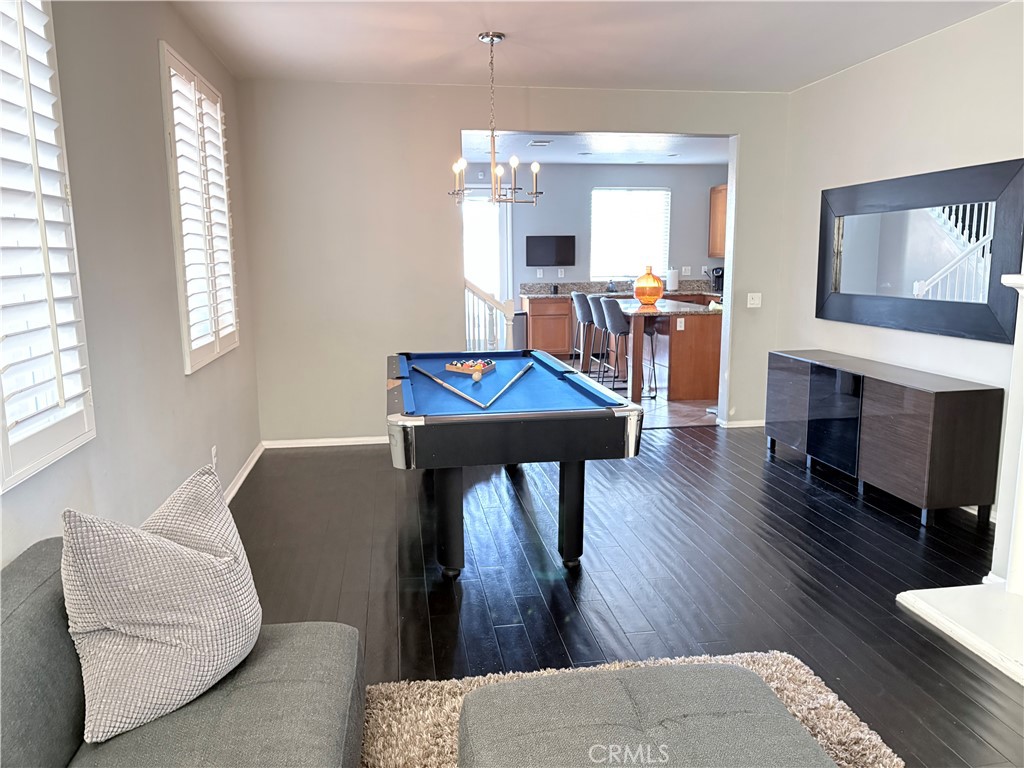 2729 Hornbeam Road Palmdale, CA 93551 - Photo 20 of 35 a living room with furniture and a wooden floor