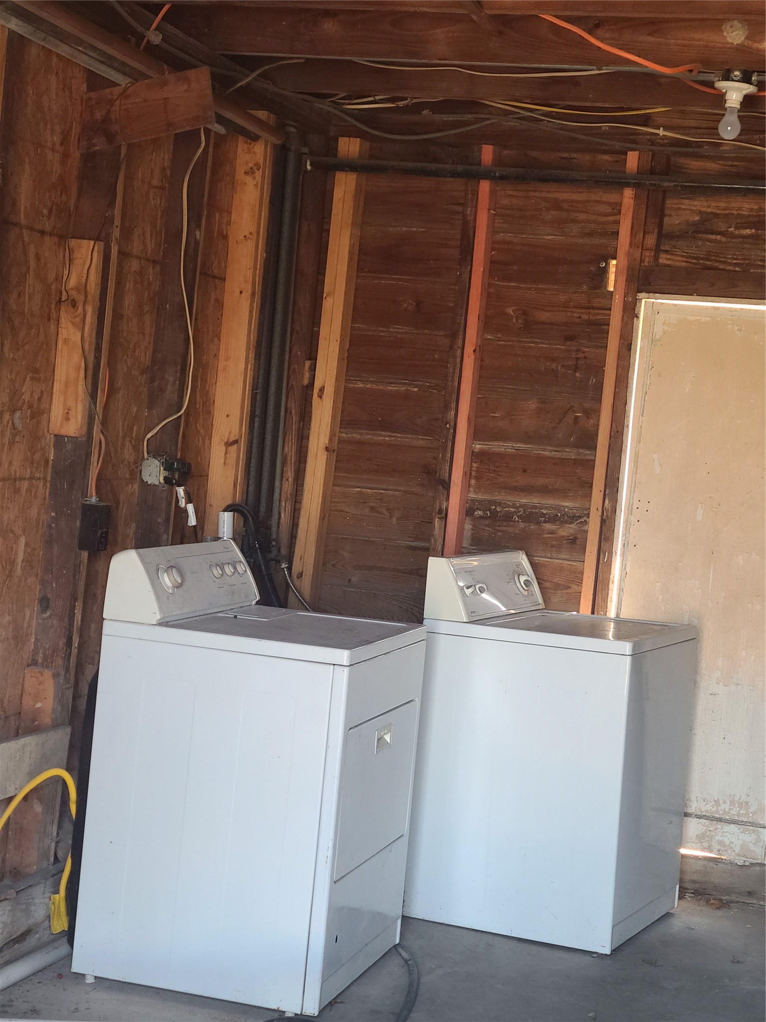 1827 Fourcade Street Houston, TX 77023 - Photo 16 of 16 a view of a storage and utility room with washer and dryer