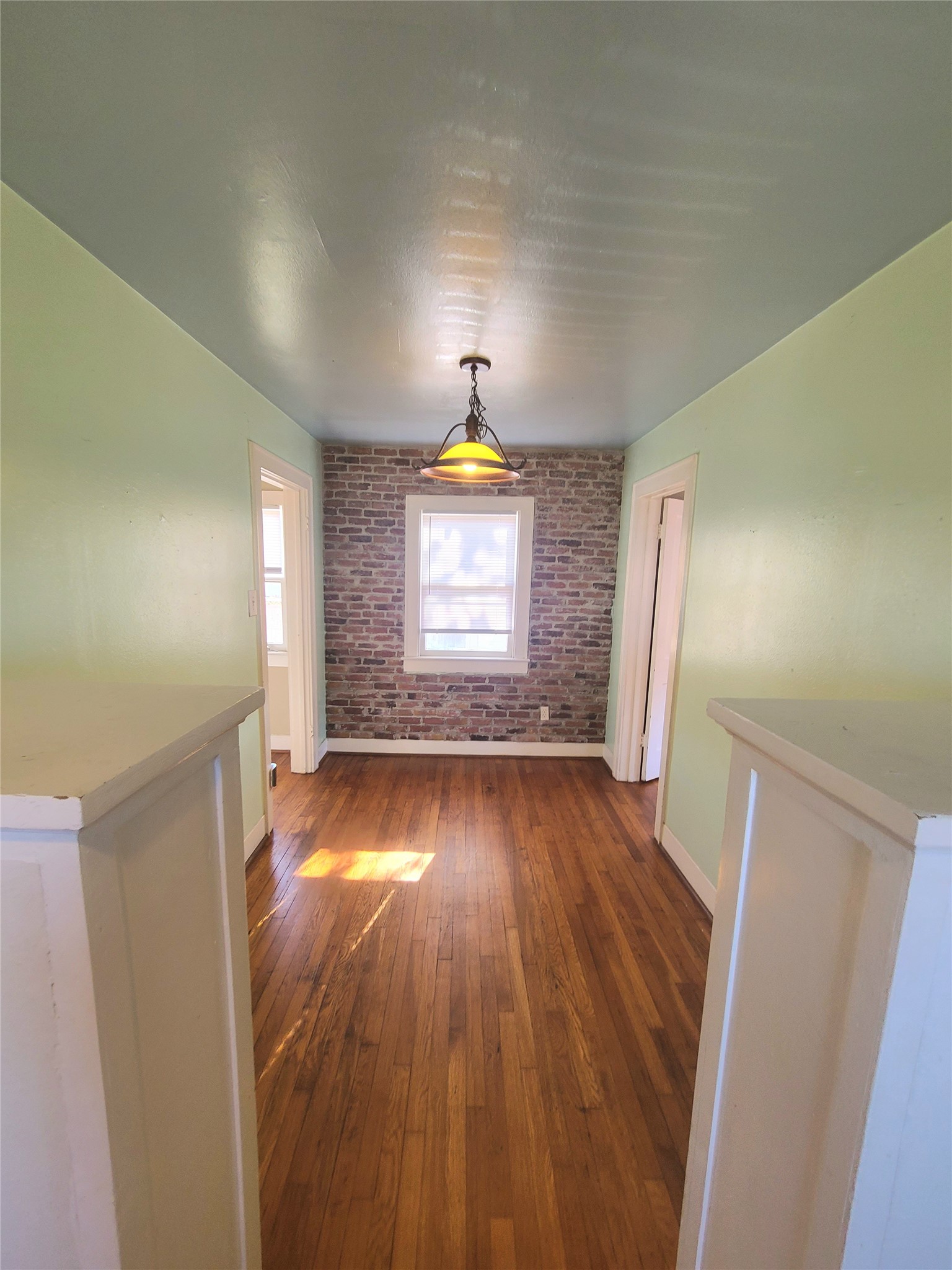 1827 Fourcade Street Houston, TX 77023 - Photo 5 of 16 a view of empty room with wooden floor and fan