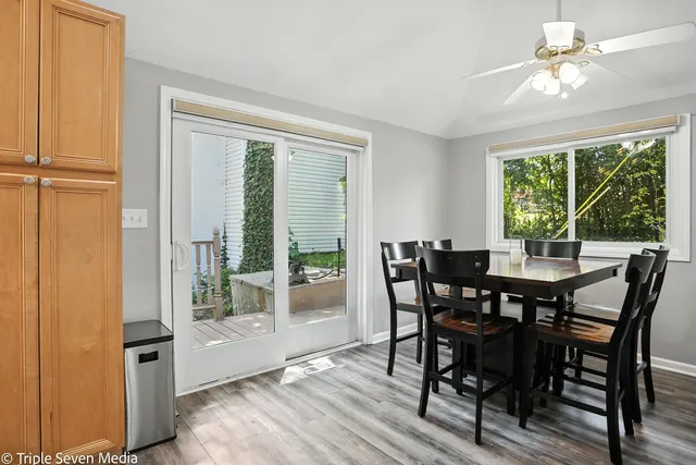a view of a dining room with furniture window and outside view