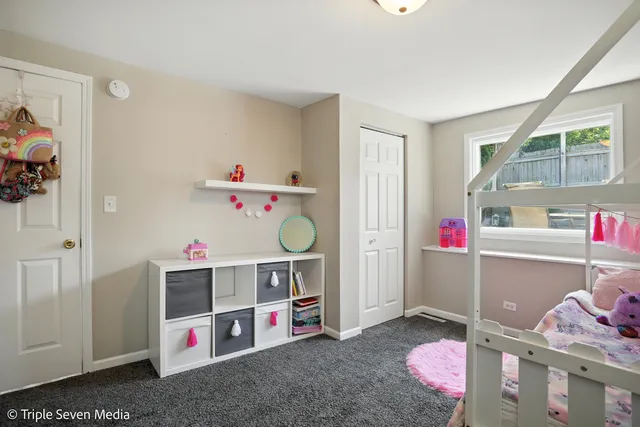 a bedroom with furniture and a wooden floor