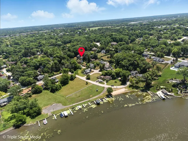 a view of a patio with table and chairs and potted plants