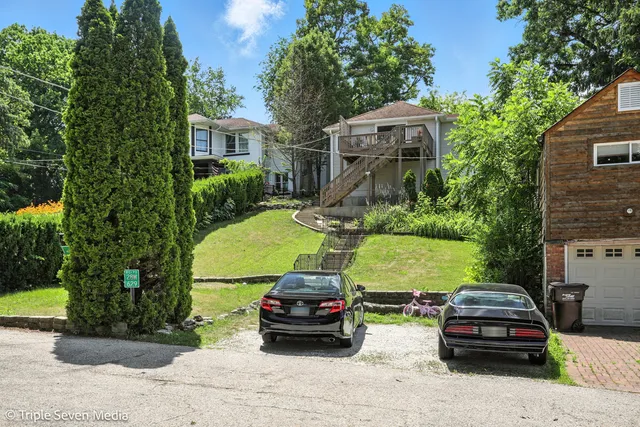 a front view of a house with garden