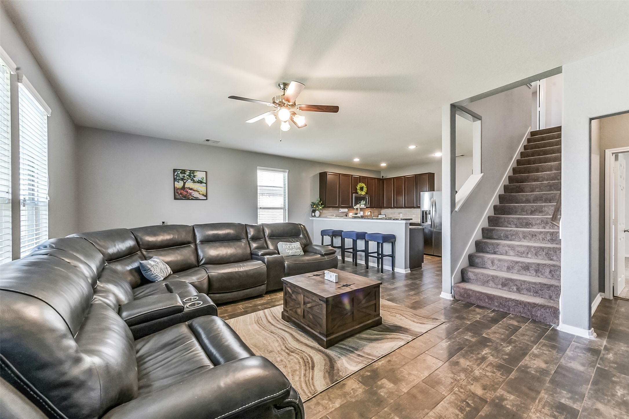 29418 Ridge Clearing Trail Spring, TX 77386 - Photo 12 of 37 a living room with furniture ceiling fan and a rug