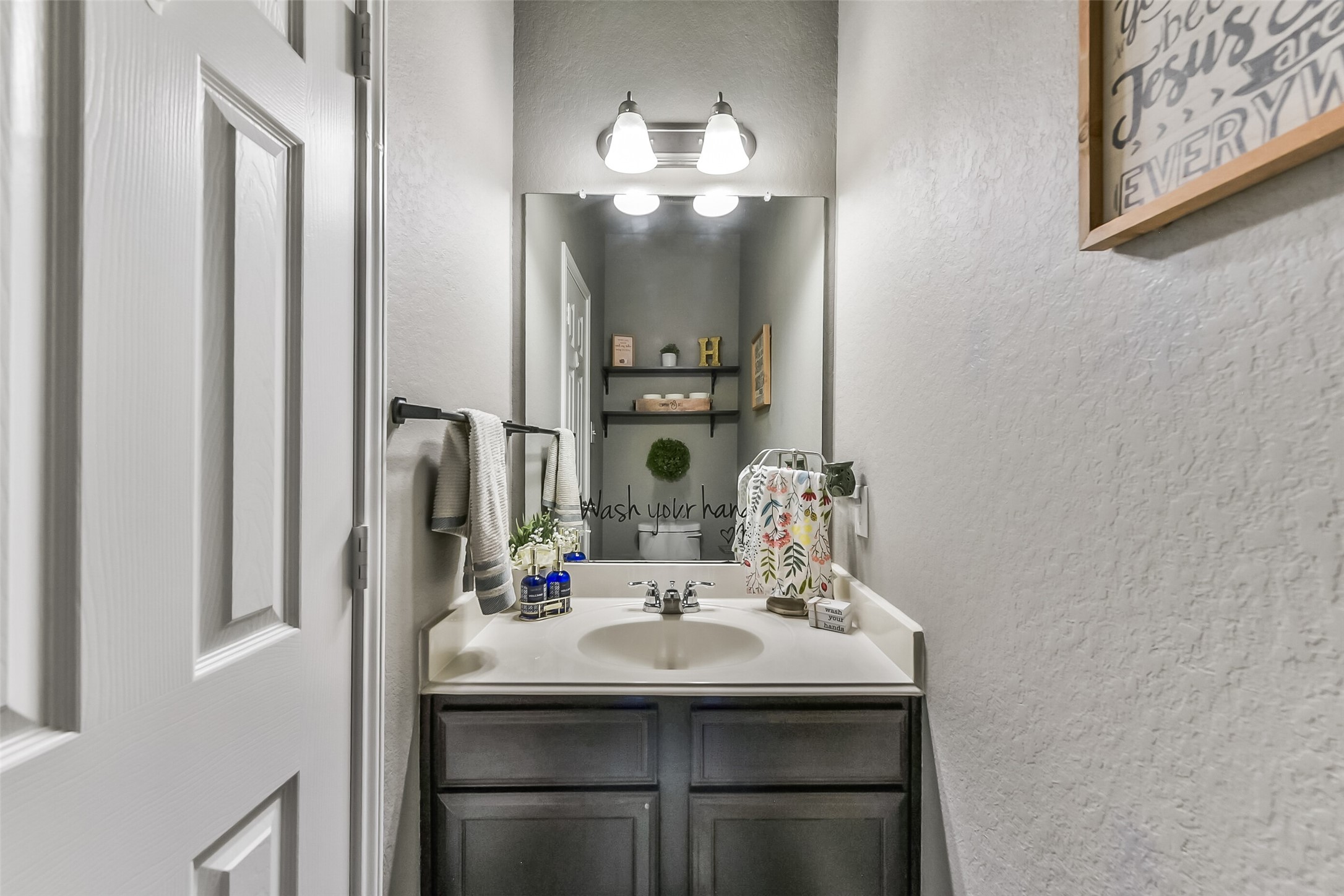 29418 Ridge Clearing Trail Spring, TX 77386 - Photo 13 of 37 a bathroom with a sink and a mirror