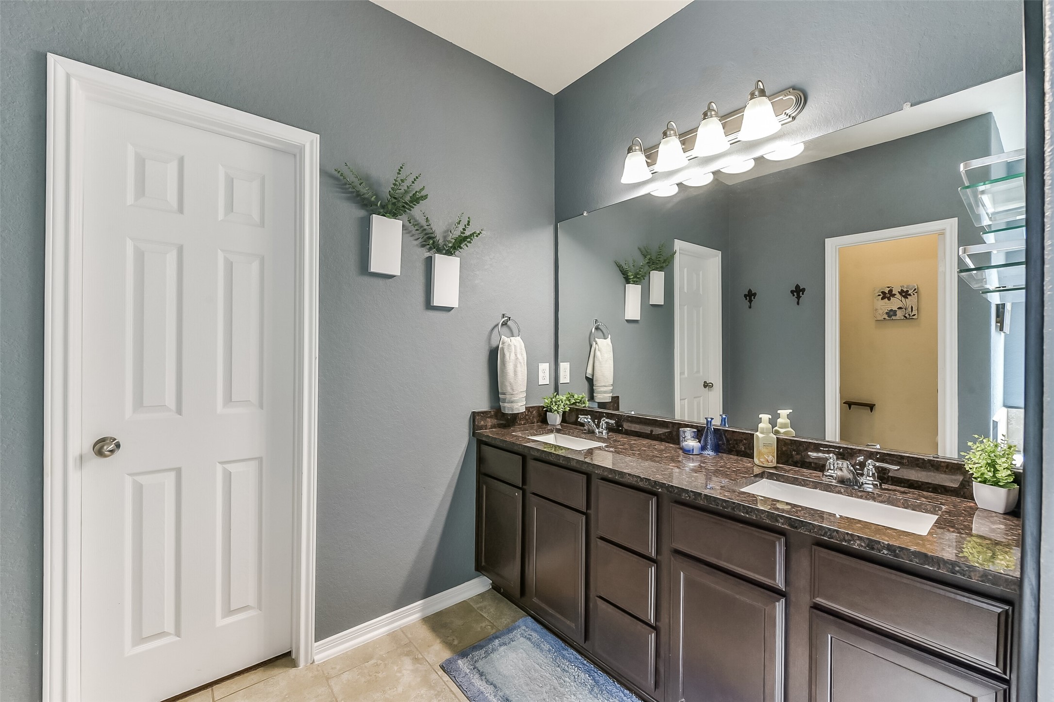 29418 Ridge Clearing Trail Spring, TX 77386 - Photo 15 of 37 a bathroom with a double vanity sink and a mirror