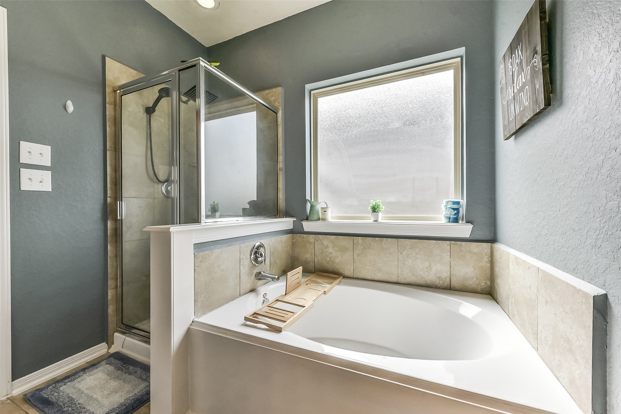 29418 Ridge Clearing Trail Spring, TX 77386 - Photo 18 of 37 a bathroom with a tub sink and mirror