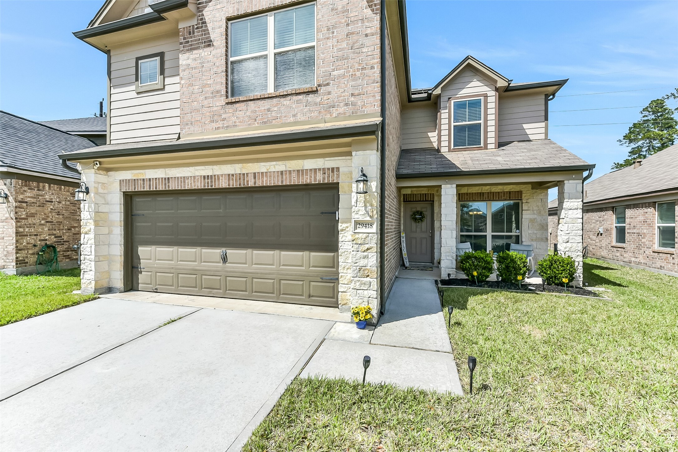 29418 Ridge Clearing Trail Spring, TX 77386 - Photo 2 of 37 a front view of a house with garden