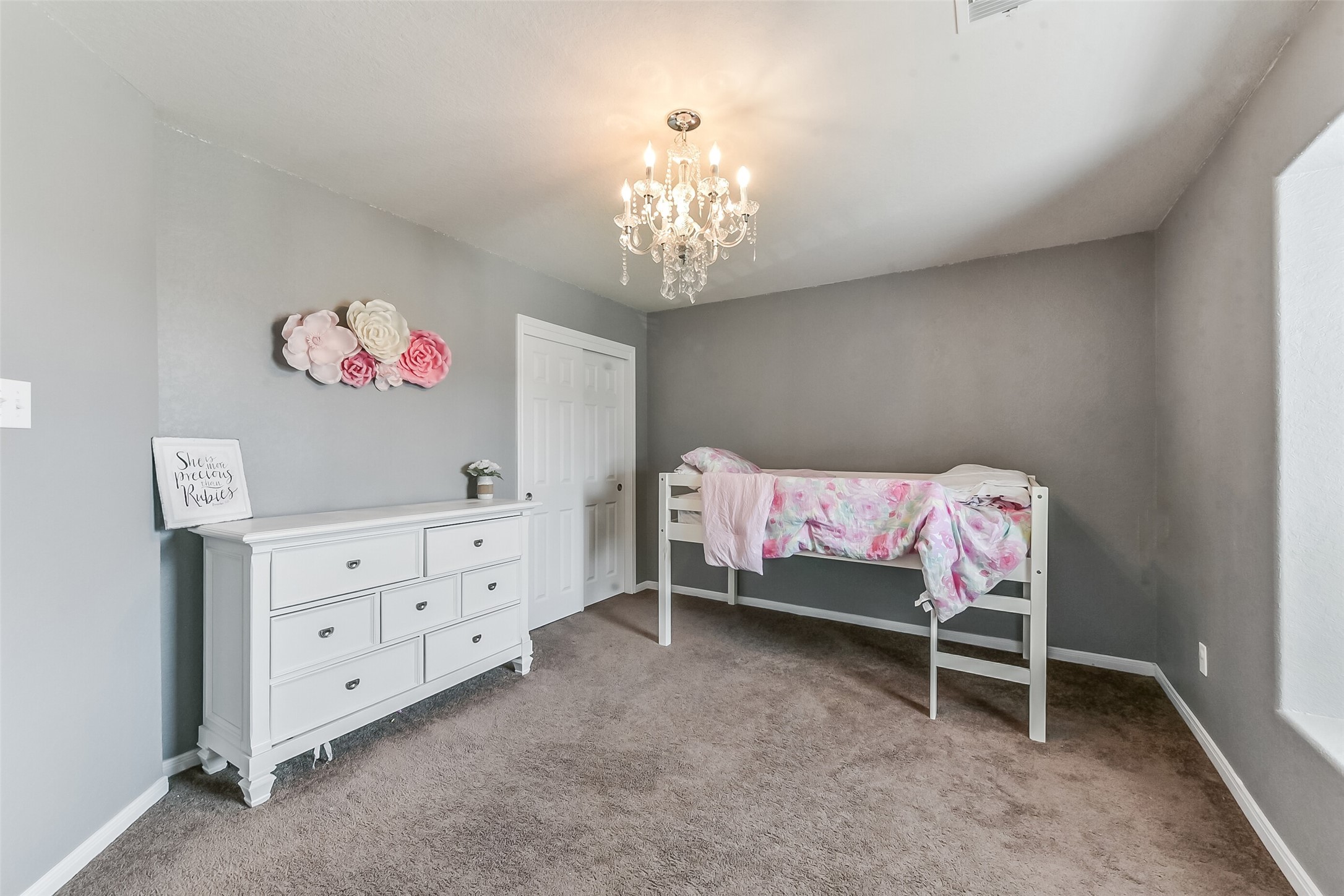 29418 Ridge Clearing Trail Spring, TX 77386 - Photo 26 of 37 a bedroom with a bed and a chandelier