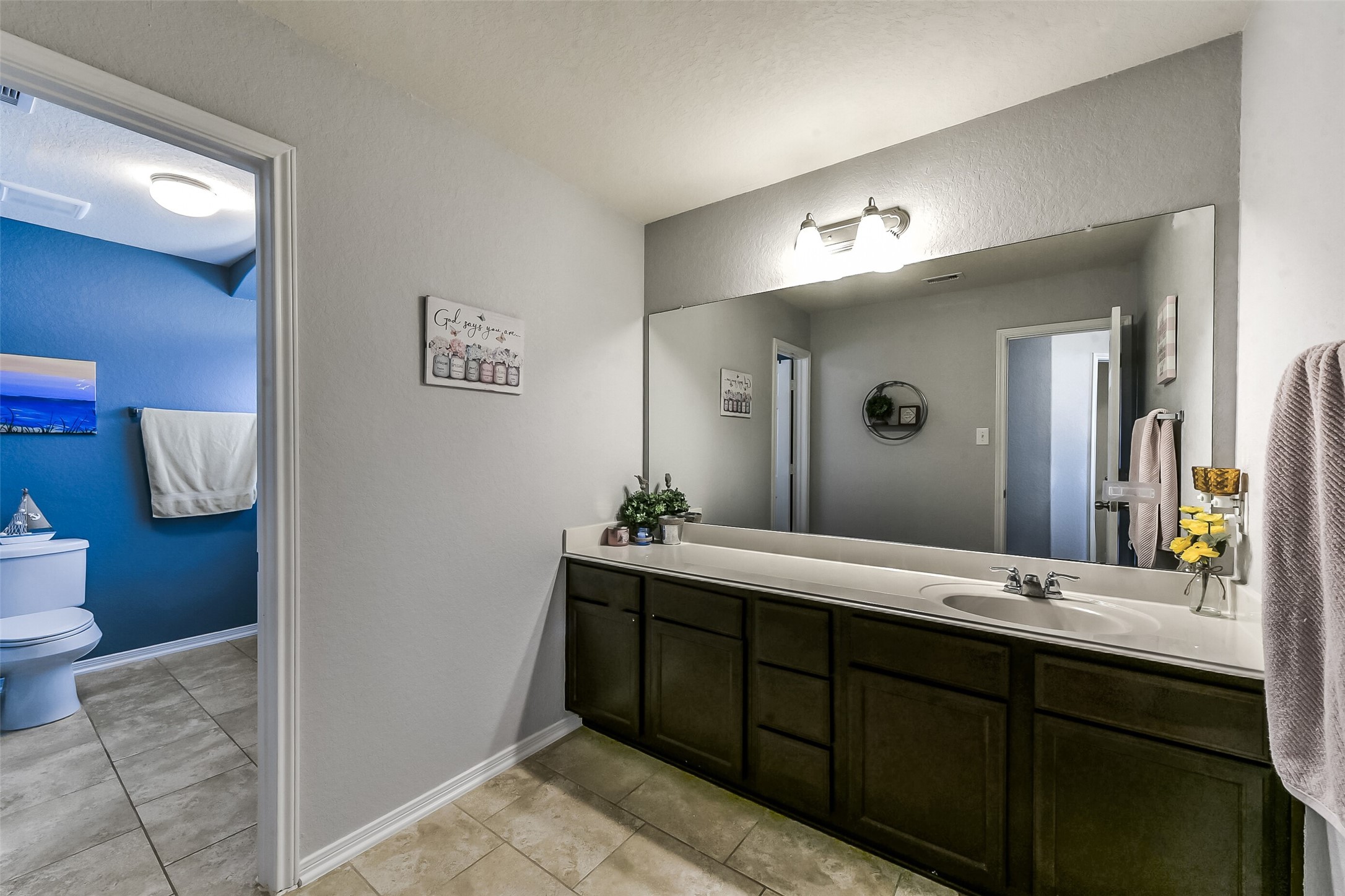 29418 Ridge Clearing Trail Spring, TX 77386 - Photo 28 of 37 a spacious bathroom with a double vanity sink and a mirror