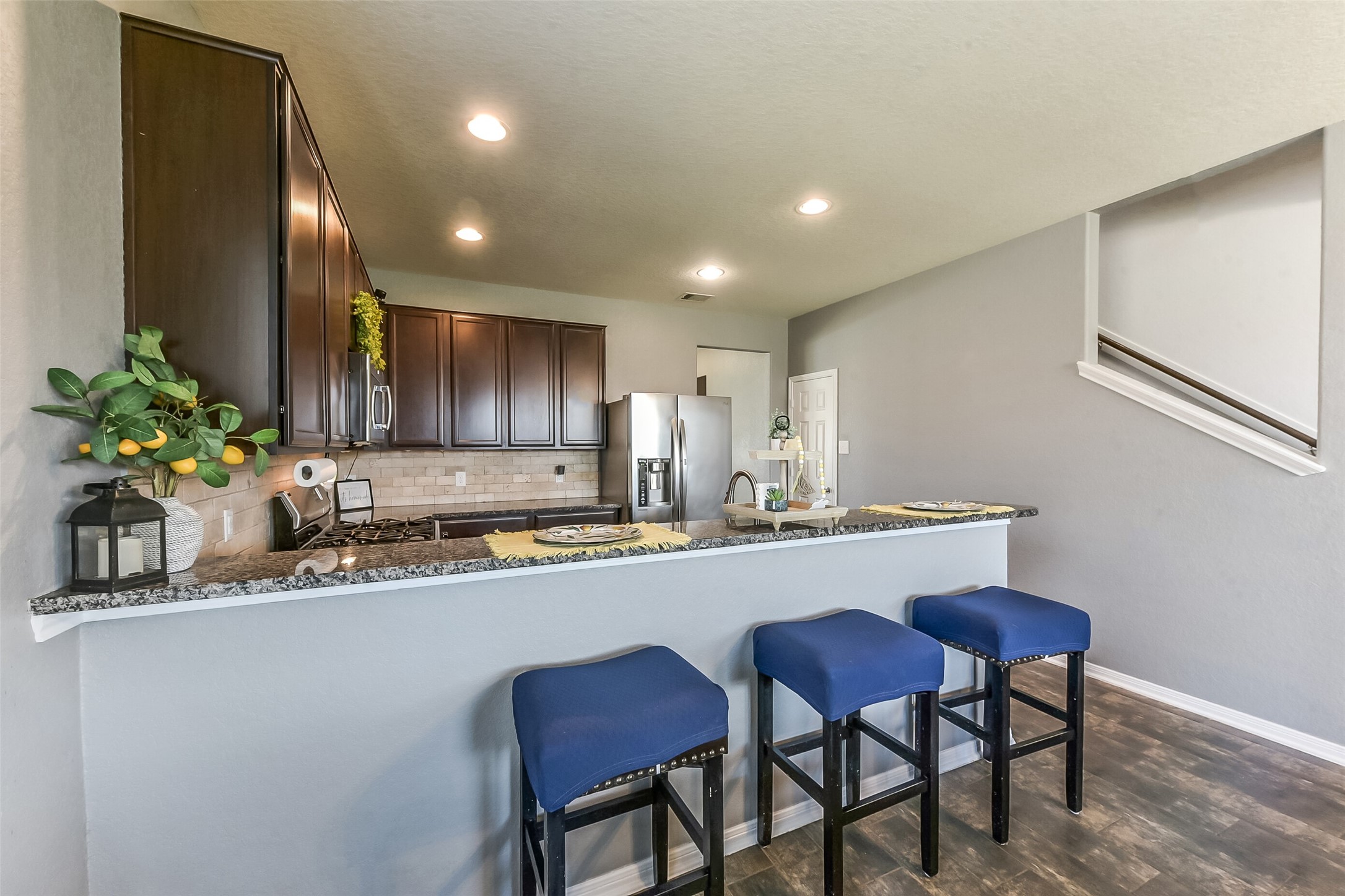 29418 Ridge Clearing Trail Spring, TX 77386 - Photo 10 of 37 a kitchen with kitchen island granite countertop a sink and a refrigerator