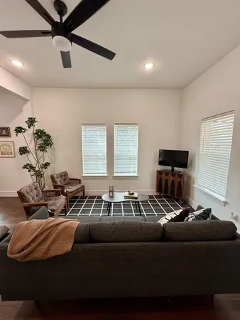 a living room with furniture and a window