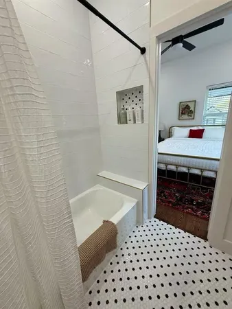 a bedroom with a bed and dresser
