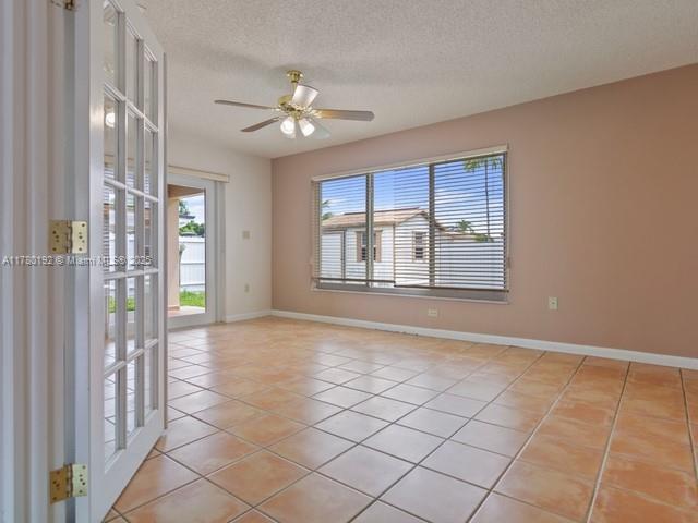 9864 Southwest 26th Terrace Miami, FL 33165 - Photo 11 of 39 a view of an empty room with a window