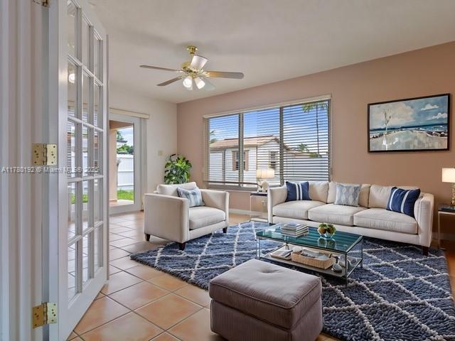 9864 Southwest 26th Terrace Miami, FL 33165 - Photo 12 of 39 a living room with furniture a chandelier and a window