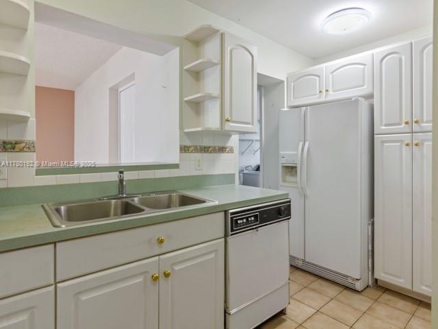 9864 Southwest 26th Terrace Miami, FL 33165 - Photo 19 of 39 a kitchen with a refrigerator and a sink