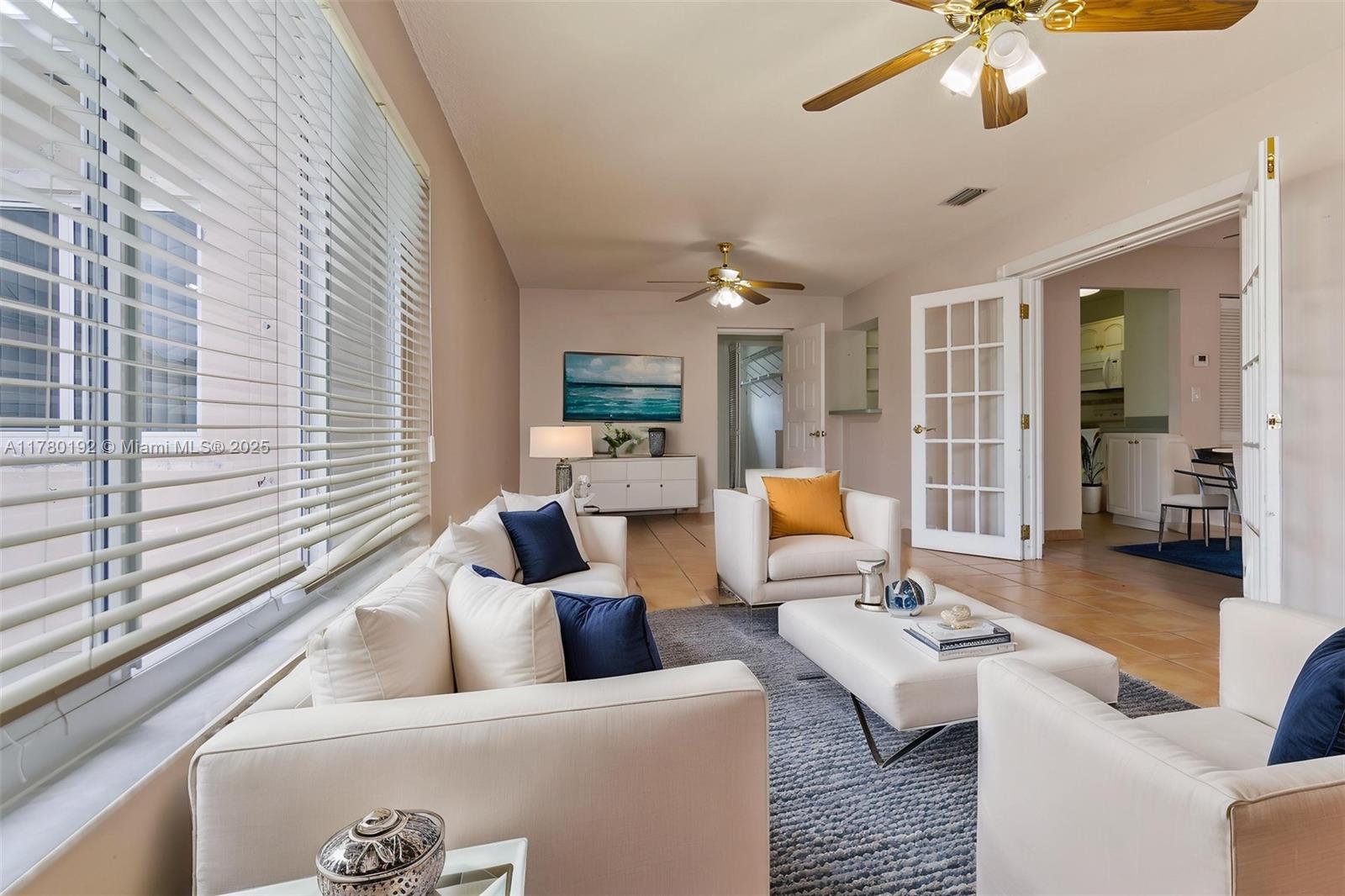 9864 Southwest 26th Terrace Miami, FL 33165 - Photo 22 of 39 a living room with furniture and a large window