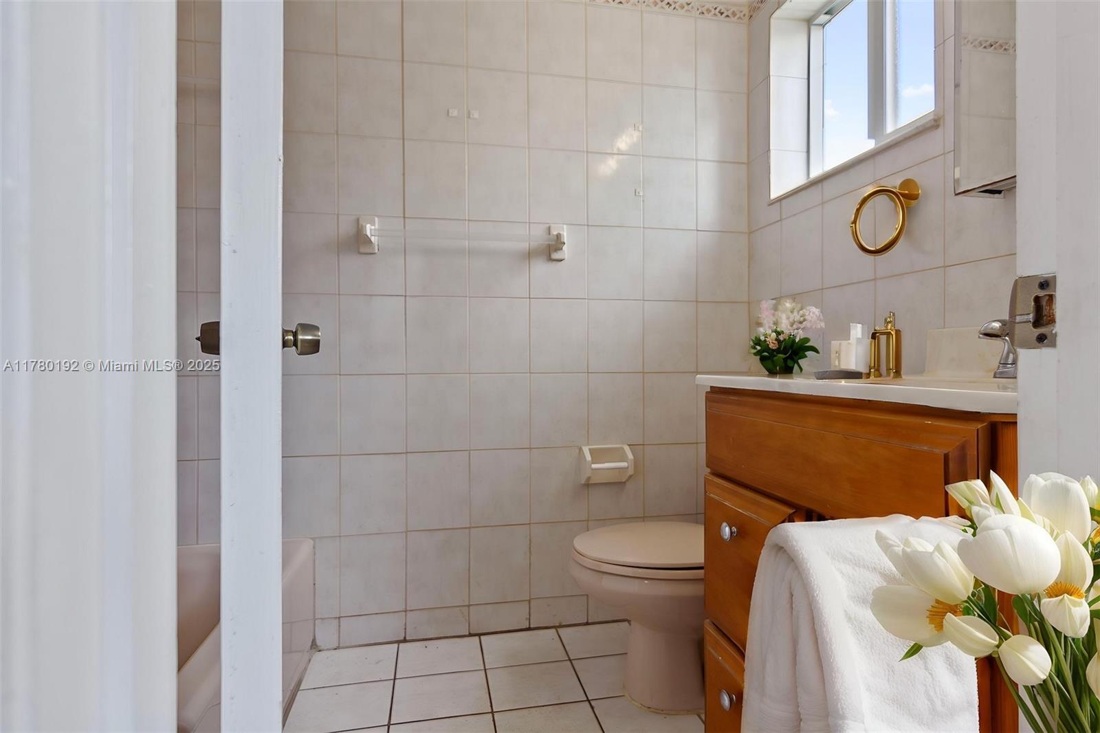 9864 Southwest 26th Terrace Miami, FL 33165 - Photo 29 of 39 a bathroom with a sink and a toilet