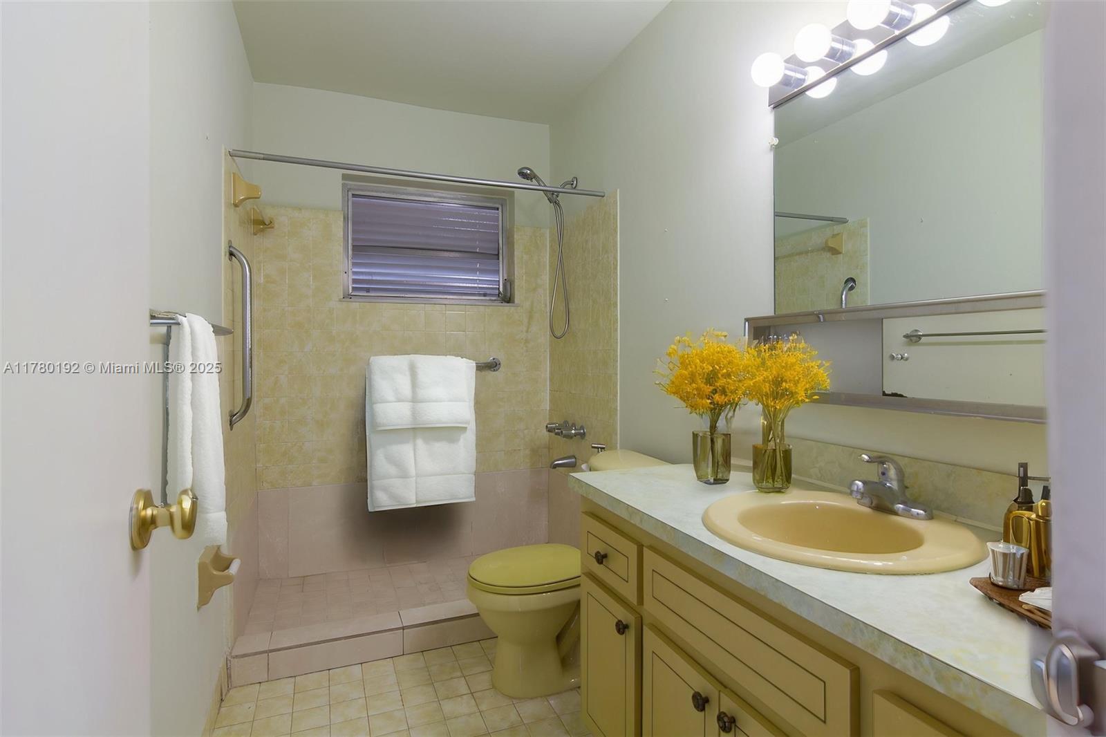 9864 Southwest 26th Terrace Miami, FL 33165 - Photo 36 of 39 a bathroom with a granite countertop sink toilet and shower