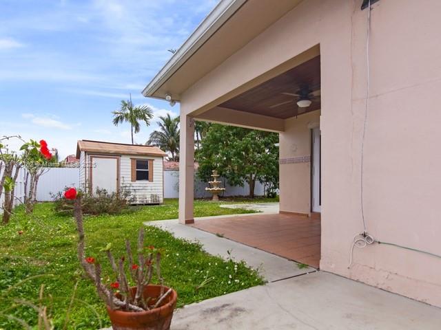 9864 Southwest 26th Terrace Miami, FL 33165 - Photo 37 of 39 a view of a house with backyard and garden