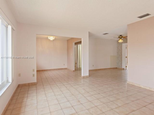 9864 Southwest 26th Terrace Miami, FL 33165 - Photo 4 of 39 an empty room with a natural light
