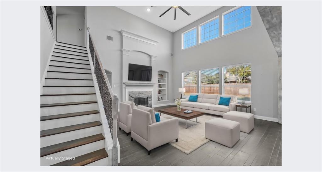 214 Hampton Drive Fate, TX 75087 - Photo 1 of 1 a living room with furniture and a fireplace