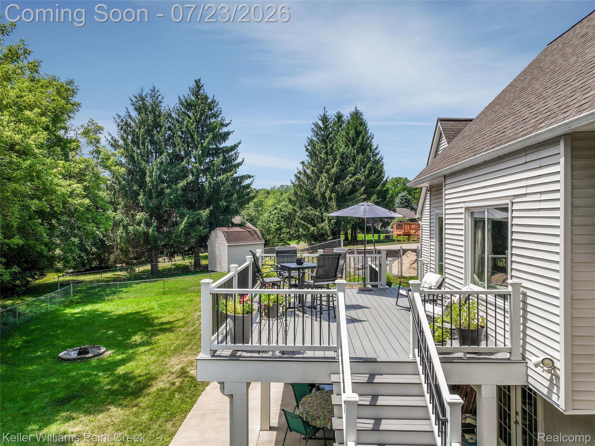 2611 Quail Run Street Rochester, MI 48306 - Photo 41 of 48 Expansive rear deck featuring composite decking and black metal railings