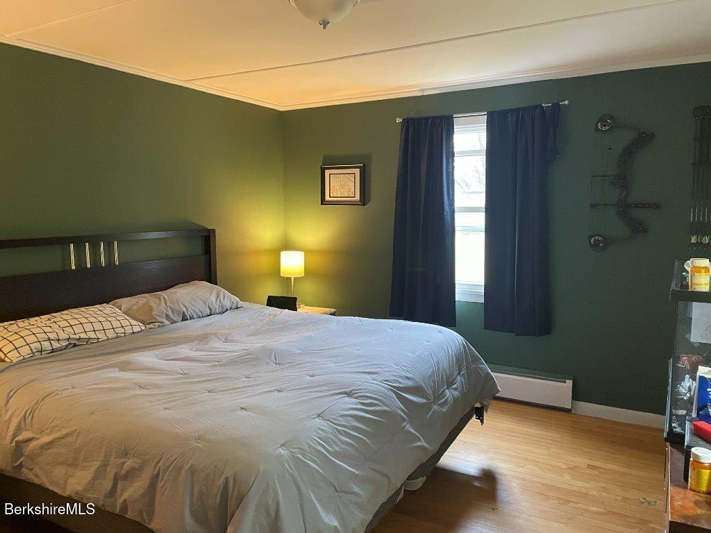 1320 Church Street North Adams, MA 01247 - Photo 15 of 33 a bedroom with a bed and wooden floor
