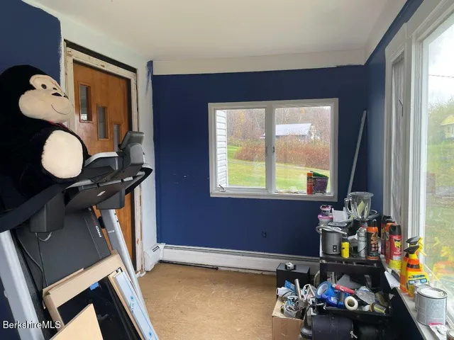 a front view of a house with wooden floor